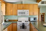 The kitchen is fully-equipped with a Refrigerator, Propane Gas Stove, Coffee Maker, Microwave, Cookware and Dishwasher